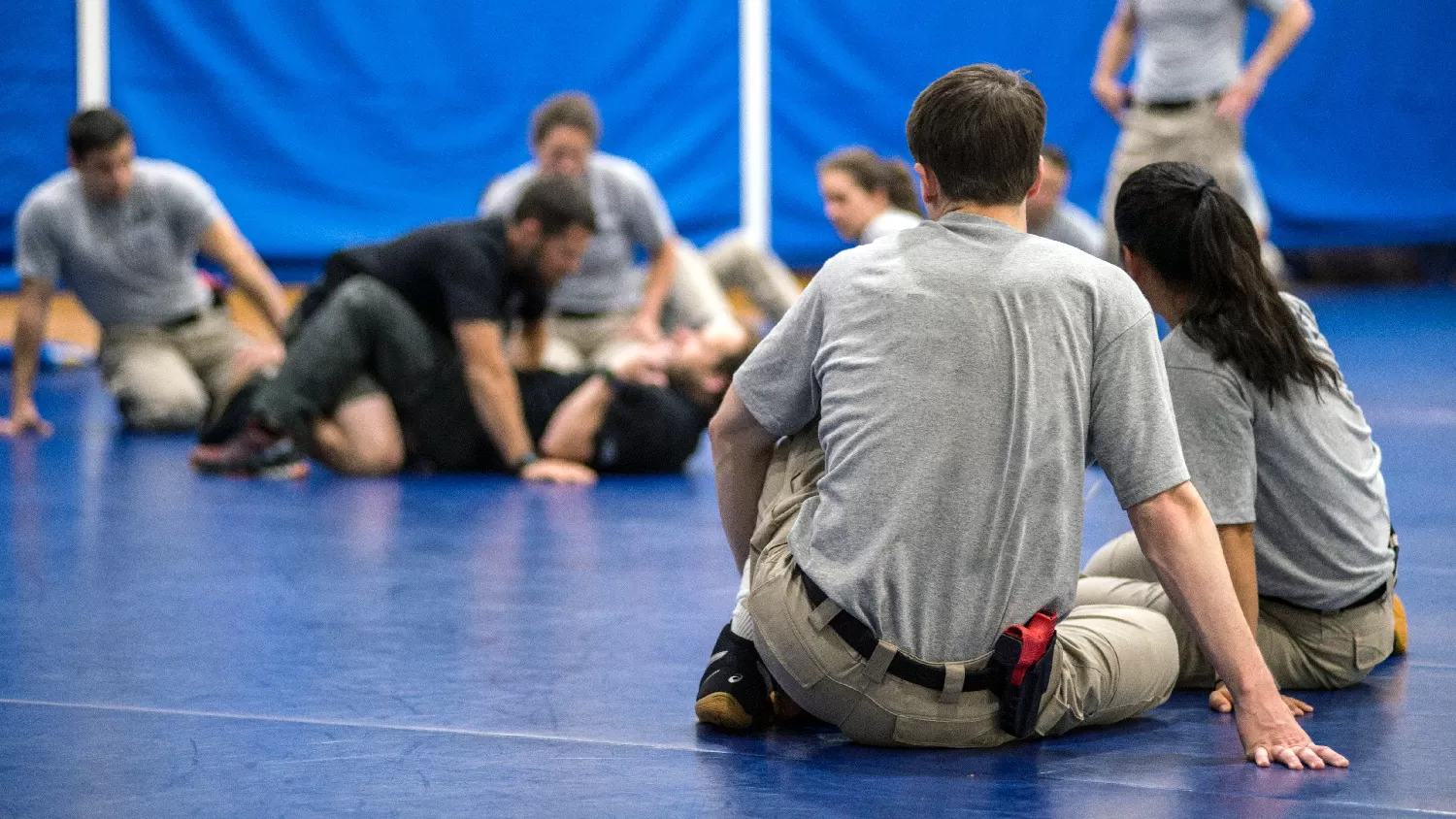 Students in training glass in a gym