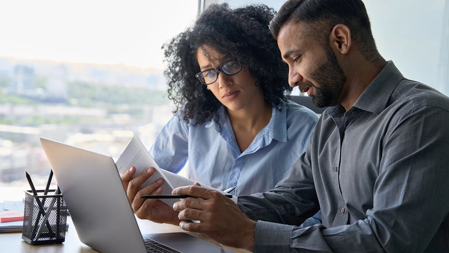 Two people working at computer