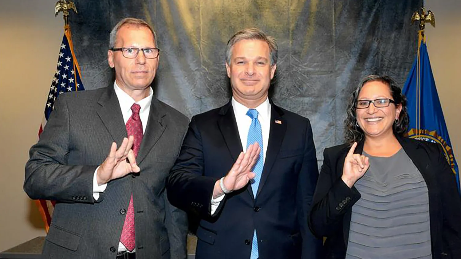 FBI employees fingerspell FBI